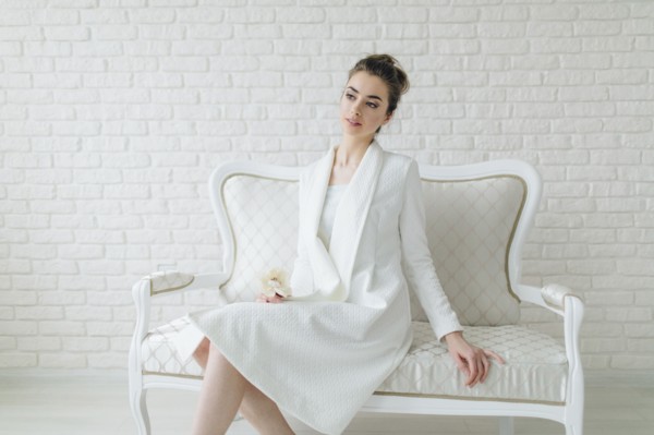 Portrait of glamorous Middle Eastern woman sitting on bench