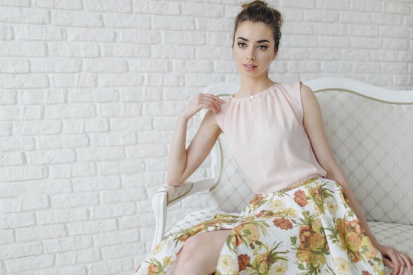 Portrait of glamorous Middle Eastern woman sitting on bench