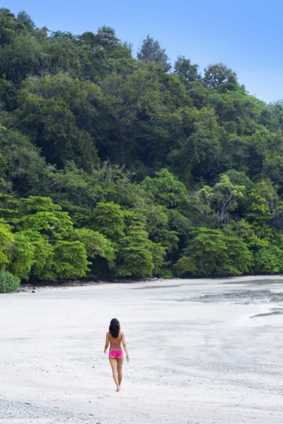 Woman walking on beach