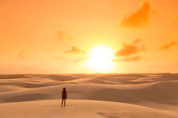 Mixed race teenage girl standing in remote desert