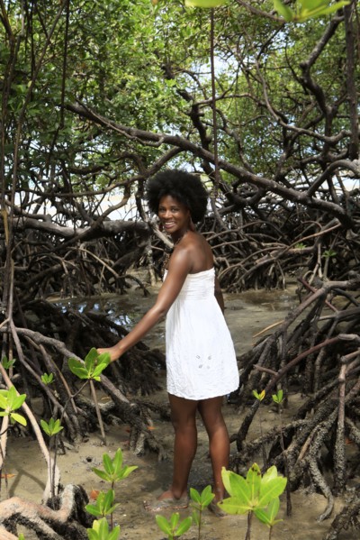Black woman smiling in mangrove jungle