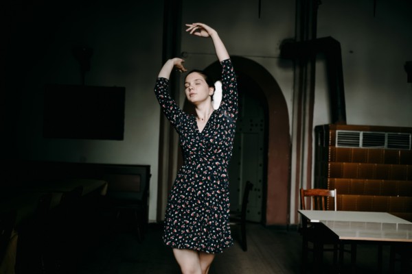 Caucasian woman dancing in livingroom