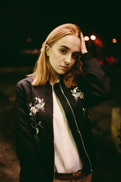 Caucasian woman wearing floral jacket