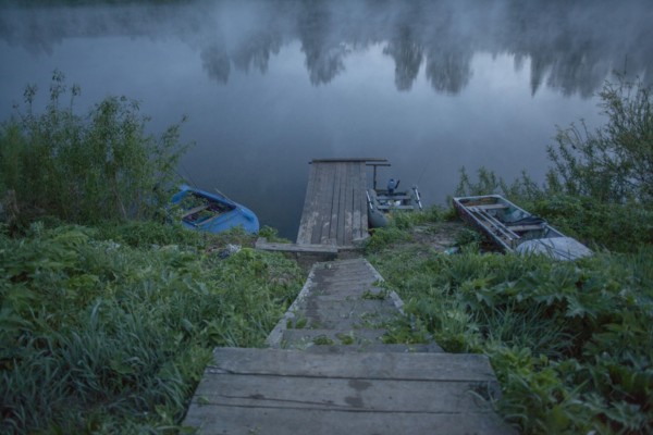 Wooden dock in still rural lake