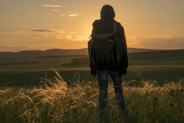 Caucasian woman admiring landscape at sunset