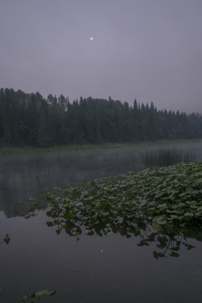 Moon over foggy river