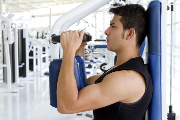 Hispanic man working out in health club