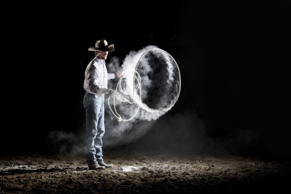 Caucasian cowboy spinning lasso