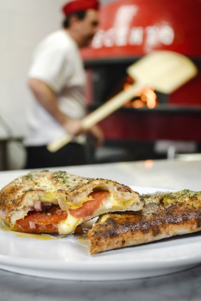 Pizza slices on plate in pizzeria