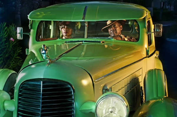 Couple in green vintage car