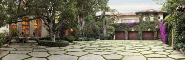 Grass driveway in front of home
