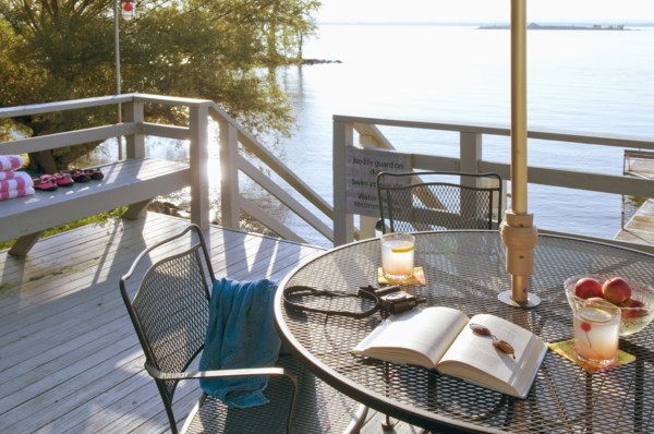 Patio table on deck by lake