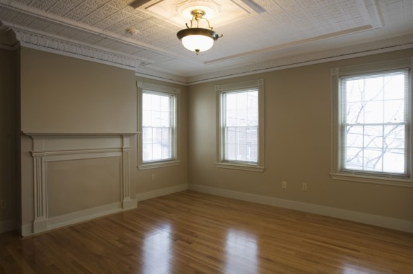 Empty room in apartment with hardwood floor