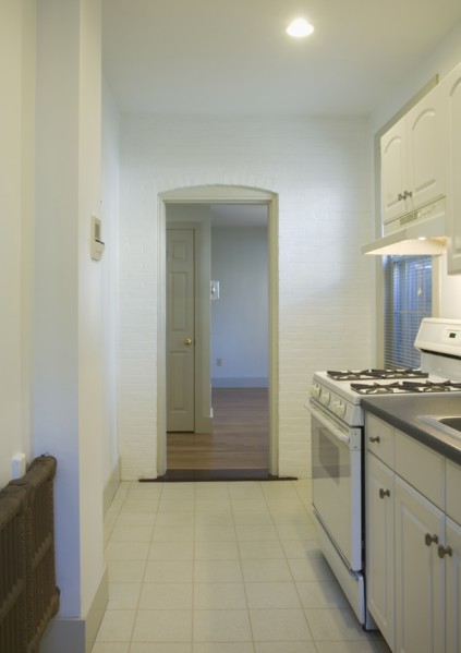 Tile floor in small apartment kitchen
