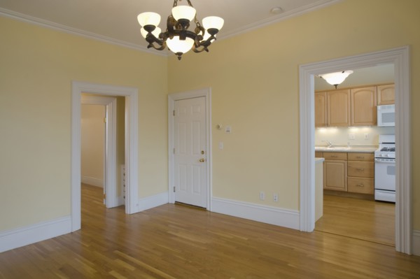 Empty room in apartment with hardwood floor
