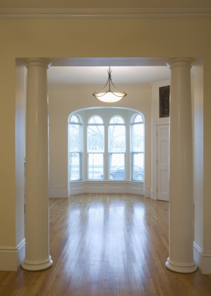 Empty room in apartment with hardwood floor and bay window