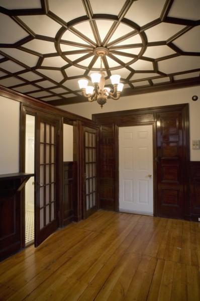 Empty room in apartment with hardwood floor