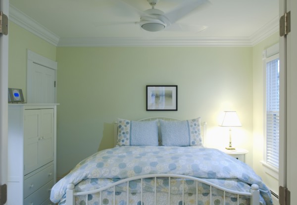 Blue and yellow bedspread on bed