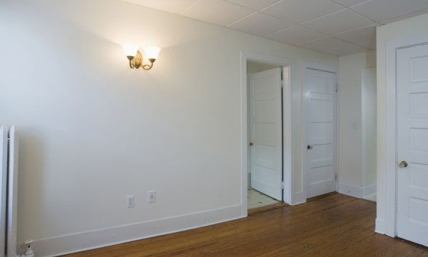 Empty room in apartment with hardwood floor