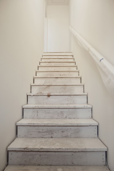 Close-up of white stairs with wall at home