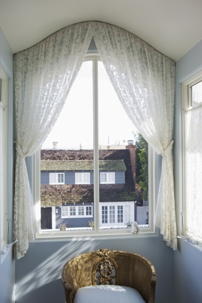 View of curtain on glass window at home