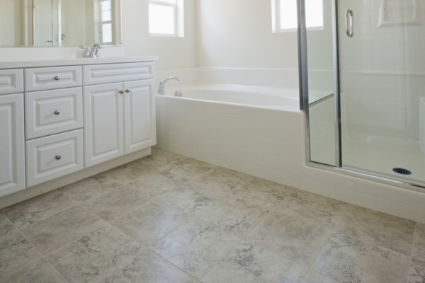 Bathroom with bath and cabinets at home