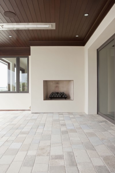 Covered patio with fireplace at Newport Beach