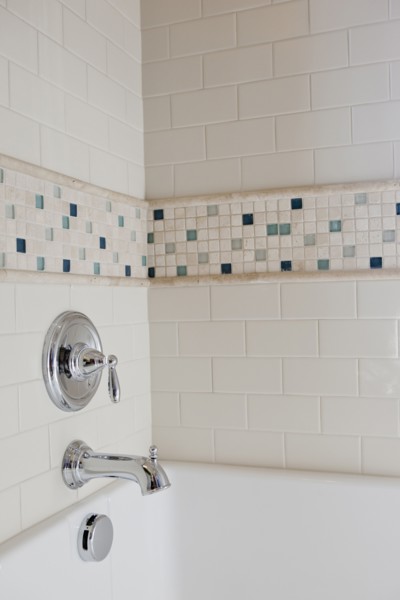 Close-up of shower taps in bathroom at home