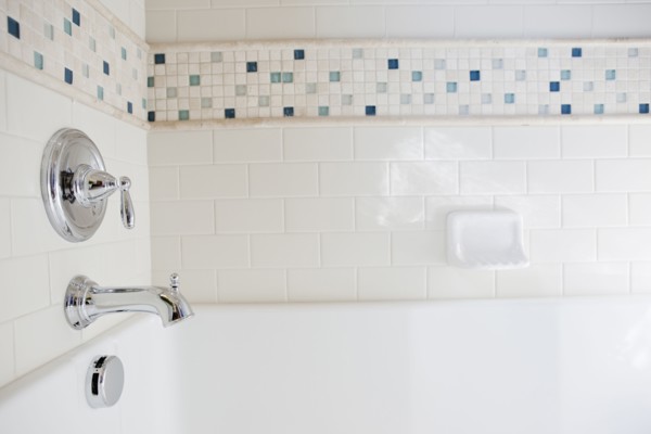 Close-up of shower taps in bathroom at home