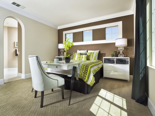 Interior of bedroom with brown accent wall