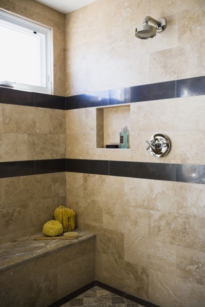 Contemporary marble shower with built in bench