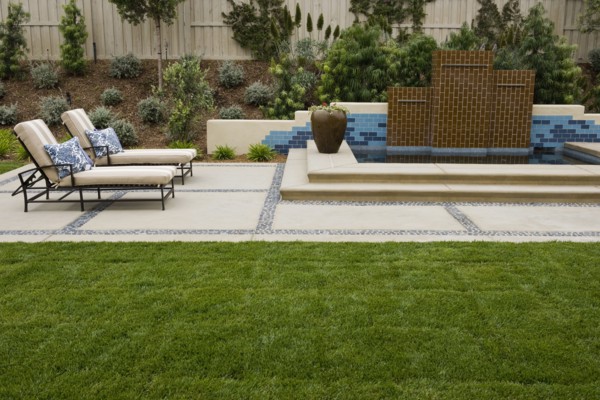 Back patio with contemporary fountain