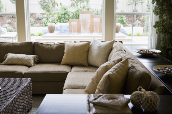 Sectional sofa in front of windows