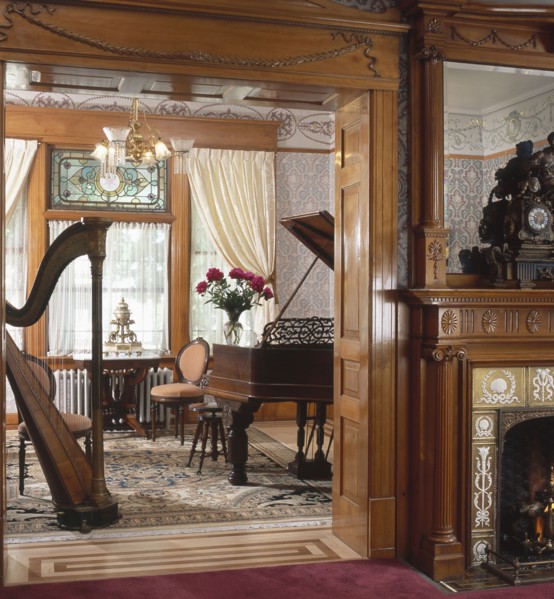 Harp and piano in music room of house