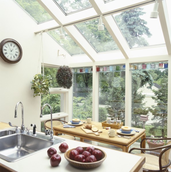 Apples in bowl in traditional kitchen with dining table