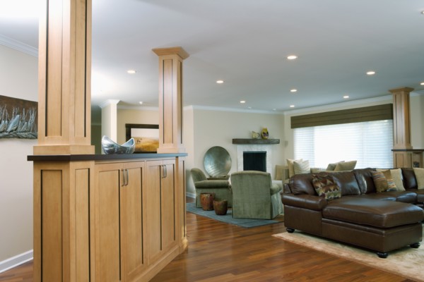 Interior of traditional living room with leather seating furniture and hardwood floor