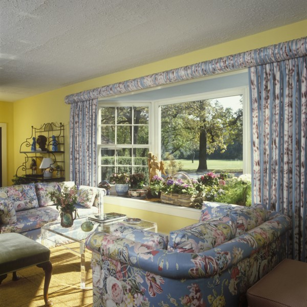 Traditional Living Room - floral chintz upholstered matching sofas and drapery