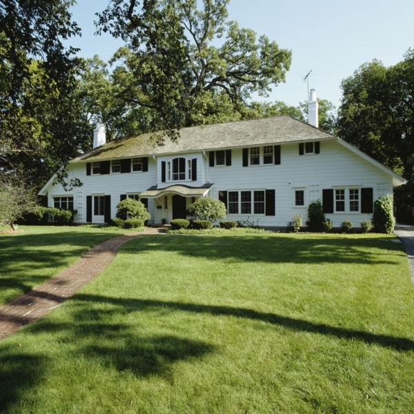 Large graceful symmetric white frame house