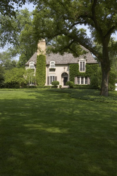 Ivy covered French Normandy style home