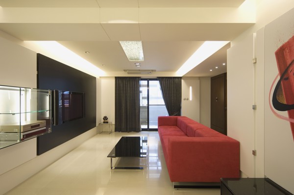 Modern living room with red sofa