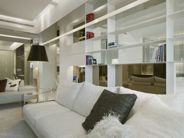 Modern sofa in front of bookshelf
