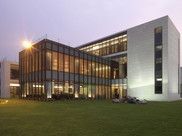 Exterior view modern building with all glass dining room