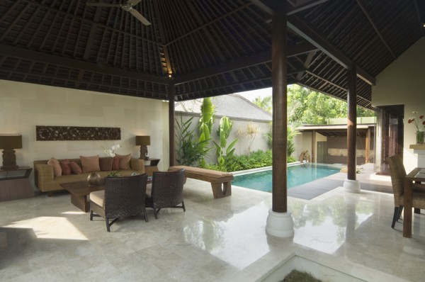 Contemporary sitting area opened up to private pool