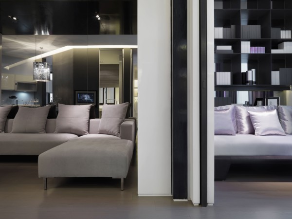 Modern sectional sofa in front of mirror