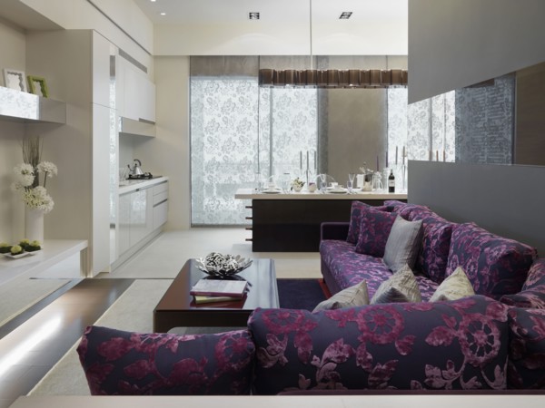 Modern purple sofa outside kitchen
