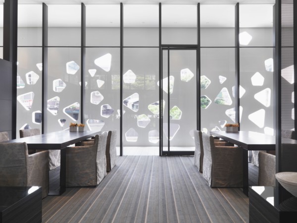 Floor to ceiling windows in modern dining room