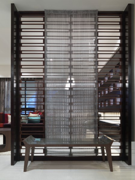 Decorative room dividing wall with bench