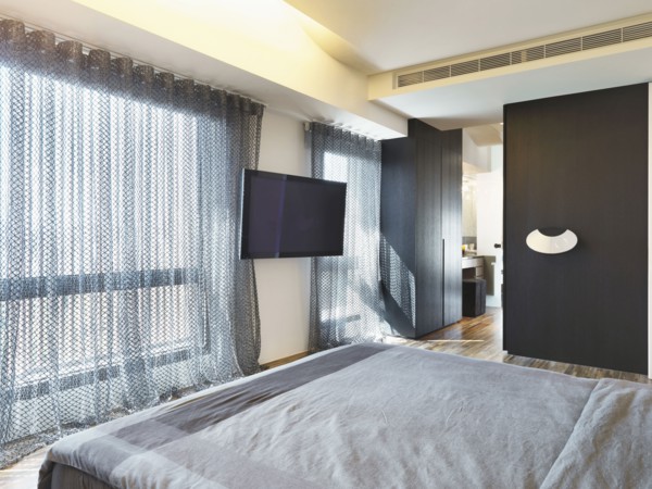 Large window in modern bedroom