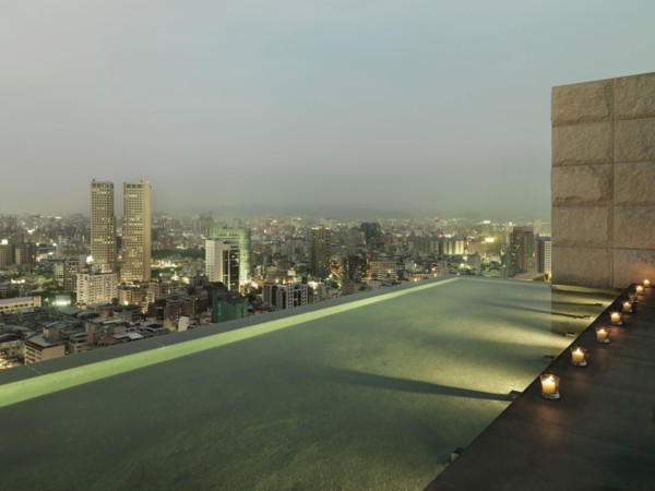 Patio and reflection pool overlooking city