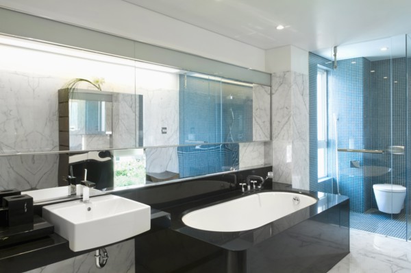 Black bathtub in modern marble bathroom